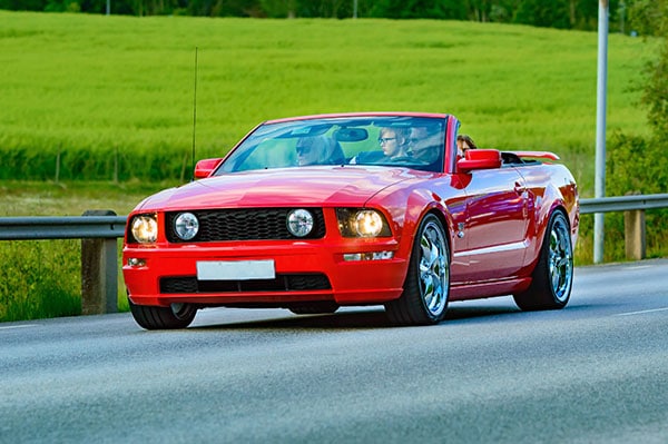 Mustang driving on road
